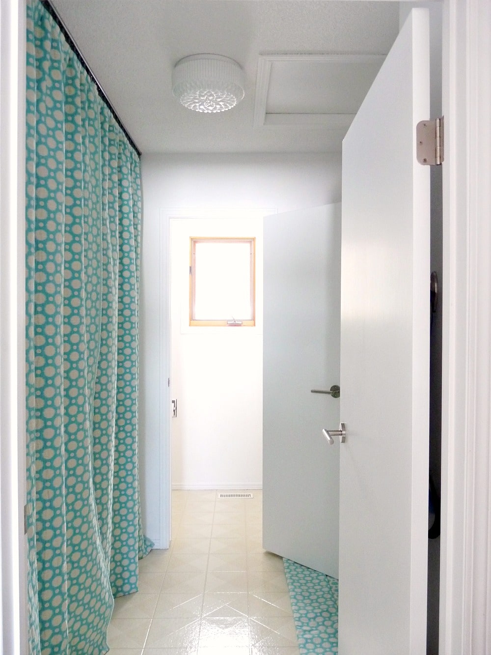 Hide a Washer and Dryer with DIY Gathered Curtains on a Track